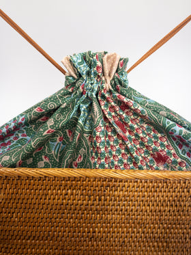Batik lining drawstrings on a rattan bag sold by Ganapati Crafts Co.