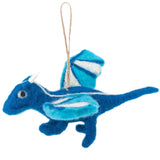 A playful wool felt flying dragon ornament is displayed against a plain white background, creating a whimsical atmosphere. This needle felted dragon features a darker blue body with light blue wings accented by white stripes. It has small round eyes and tiny white horns, completing its charming appearance.