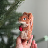 Handmade felt squirrel finger puppets holding acorn and nut, eco-friendly wool toys for kids, storytelling, or woodland pretend play.