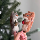 Handmade felt squirrel finger puppets holding acorn and nut, eco-friendly wool toys for kids, storytelling, or woodland pretend play.
