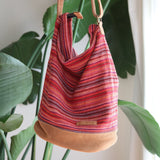 Red Woven sling bag with a zipper. Handmade in Nepal.