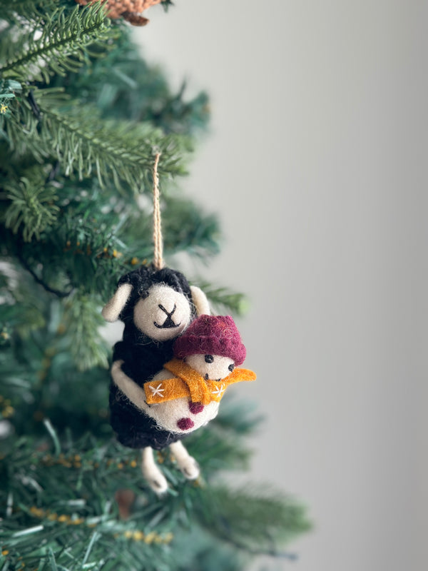 Black Sheep Holding Snowman Ornament