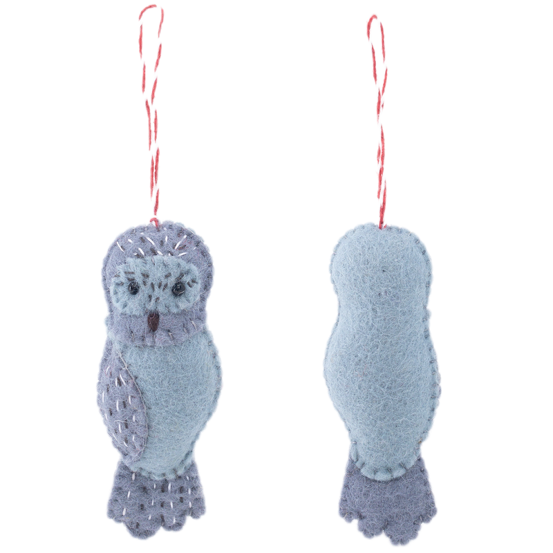Two handcrafted wool felt owl ornaments from the 'Owl Family' collection are displayed against a clean white background, showcasing both their front and back views. The charming grey owl features small black eyes, a beak, and lighter grey patterns accented with white stitching on its head, wings, and chest. A red and white cotton string is attached for hanging, with the back showing a simpler, uniform light grey design.