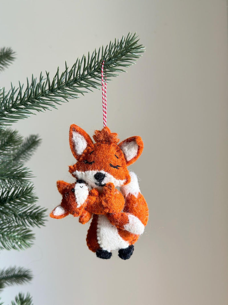 Fox holding baby ornament