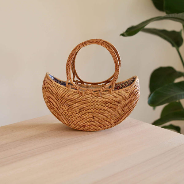Bali Rattan Boat Clutch handmade by Ganapati Crafts Co. in Bali is the perfect accessory for any stylish woman