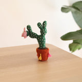 The cute felt potted prickly pear cactus is hand-made in Nepal using organic wool and eco-friendly dyes. The cactus is needle felted individually. The felt terracotta pot is decorated with colorful tassels. It is 3D designed to look great at any angle. Perfect gift for cactus lovers and it's a wonderful decor for the nursery.