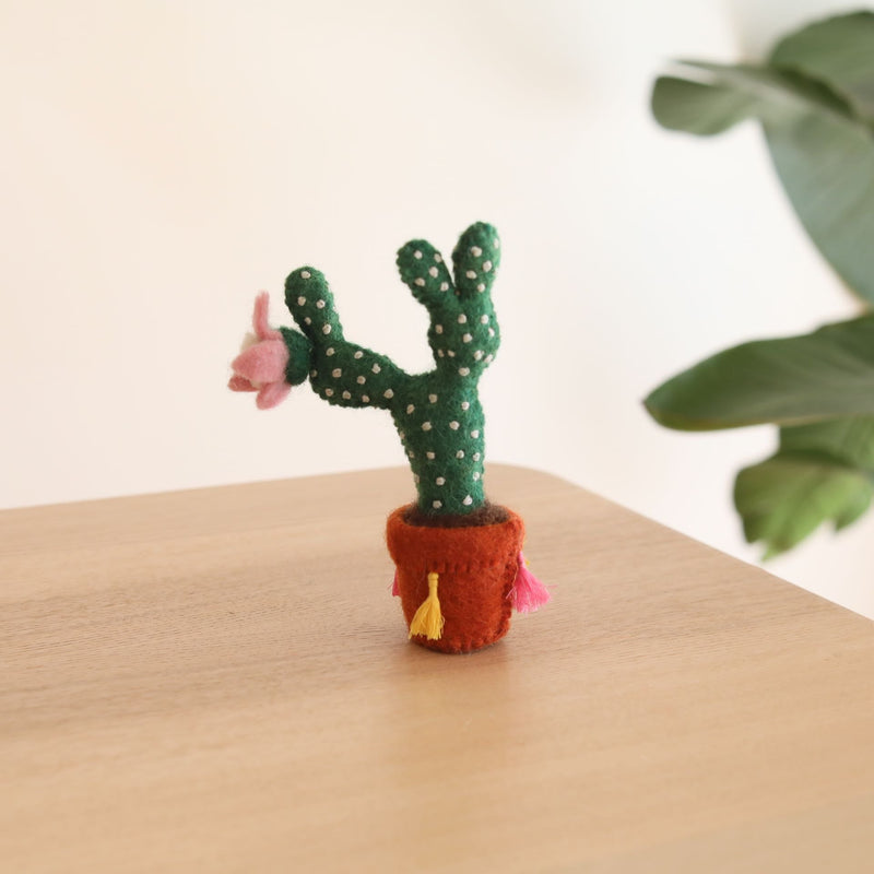 The cute felt potted prickly pear cactus is hand-made in Nepal using organic wool and eco-friendly dyes. The cactus is needle felted individually. The felt terracotta pot is decorated with colorful tassels. It is 3D designed to look great at any angle. Perfect gift for cactus lovers and it's a wonderful decor for the nursery.