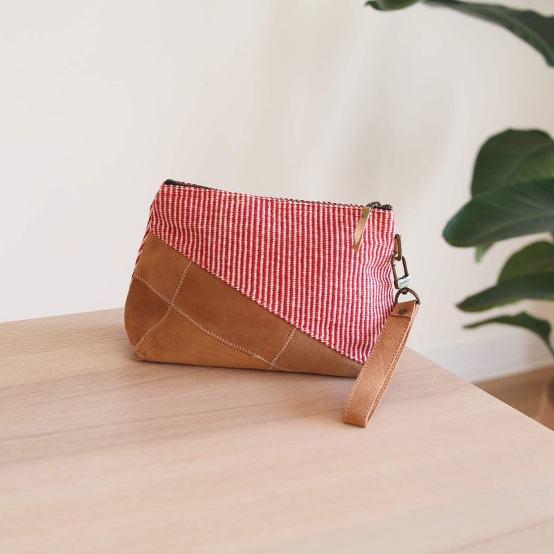 This oblique makeup bag is a perfect fusion of traditional weaving in modern style. Designed in the USA by Ganapati Crafts Co. Handmade in Nepal with love.